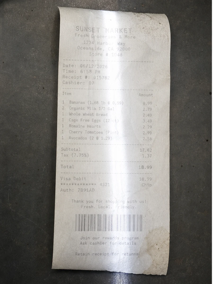 Before: The thermal receipt is curled, faded, wrinkled, and partly shadowed.